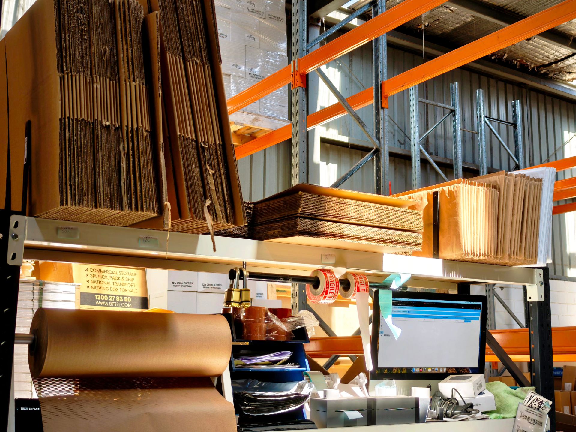 Packing workbench beside warehouse racking at BPT Fulfilment